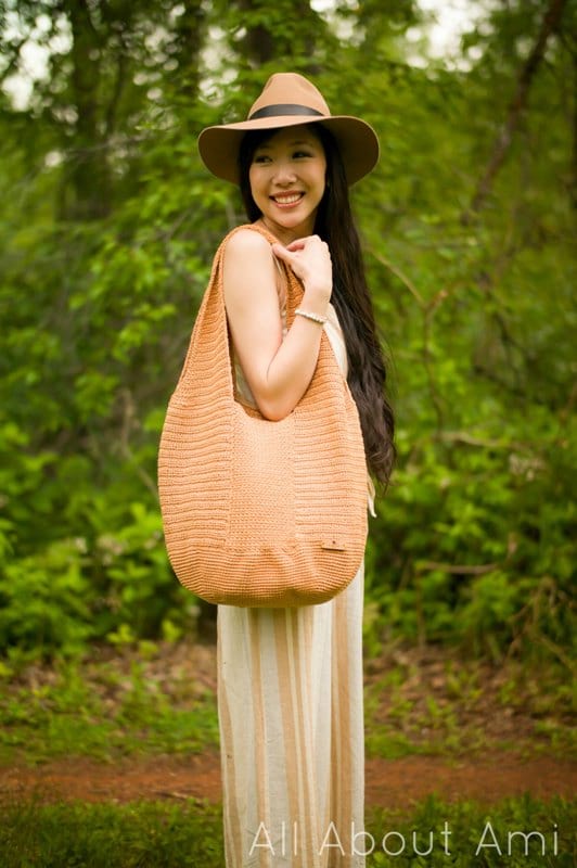 crochet tote bag over woman's shoulder